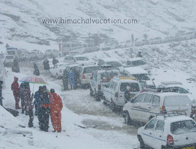 Tourists enjoy snowfall