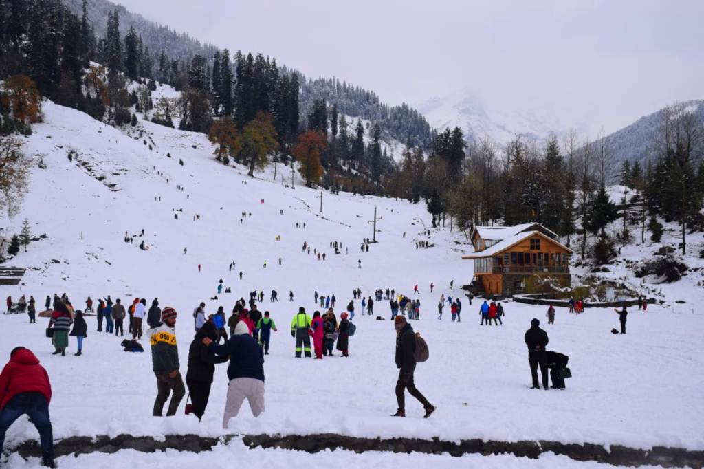 Tourists enjoy snow at Solang valley